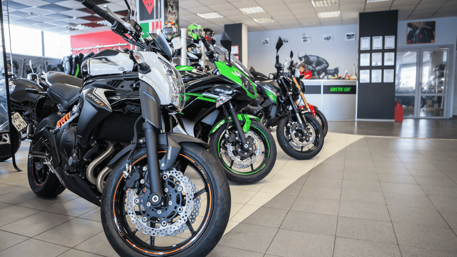 Motorcycle Dealer Websites How to Go from Good to Great A photo taken inside a motorcycle dealerships, displaying several motorcycles for sale.